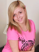 Busty blonde poses in her mini skirt and pink shirt before stripping to her panties